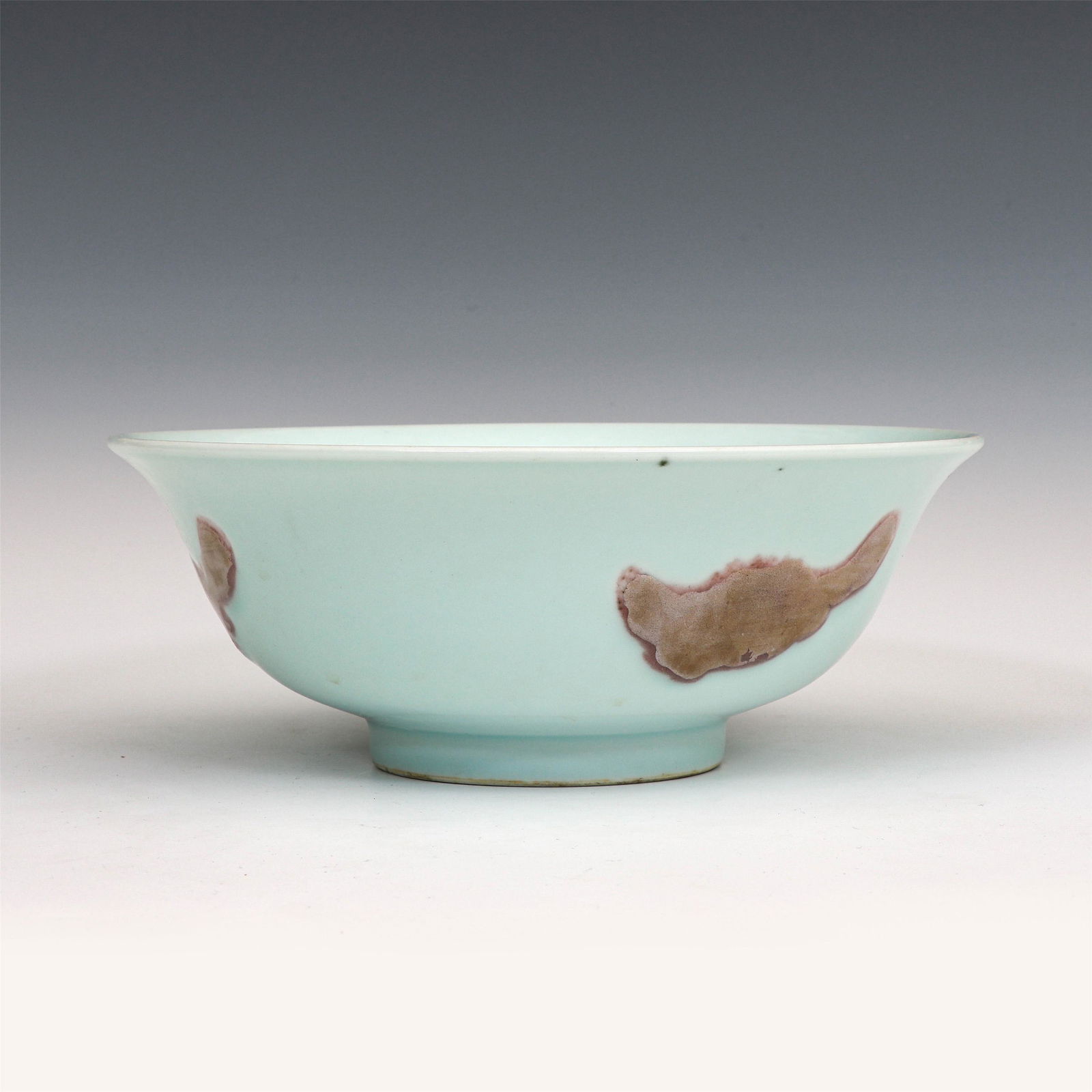 CHINESE RED UNDER GLAZE FISH PATTERN BOWL: Dimensions: 8.8 x 23.2 x 23.2 cm PROVENANCE: From The Estate of Christopher Anderson (1925-April 25, 2019) Wilkes-Barre, PA. Joined the United States Marines Corps in 1946, fought in the Battle of Cho