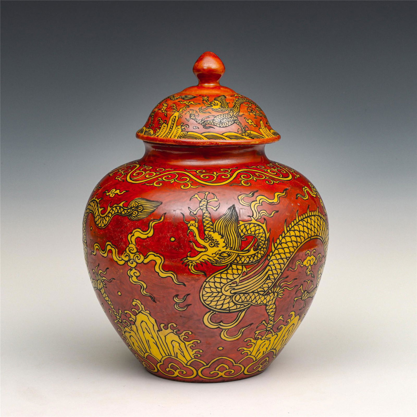CHINESE RED GLAZED PORCELAIN DRAGON PATTERN JAR AND: Dimensions: 30.5 x 21.5 x 21.5 cm PROVENANCE: From The Estate of Christopher Anderson (1925-April 25, 2019) Wilkes-Barre, PA. Joined the United States Marines Corps in 1946, fought in the Battle of Ch