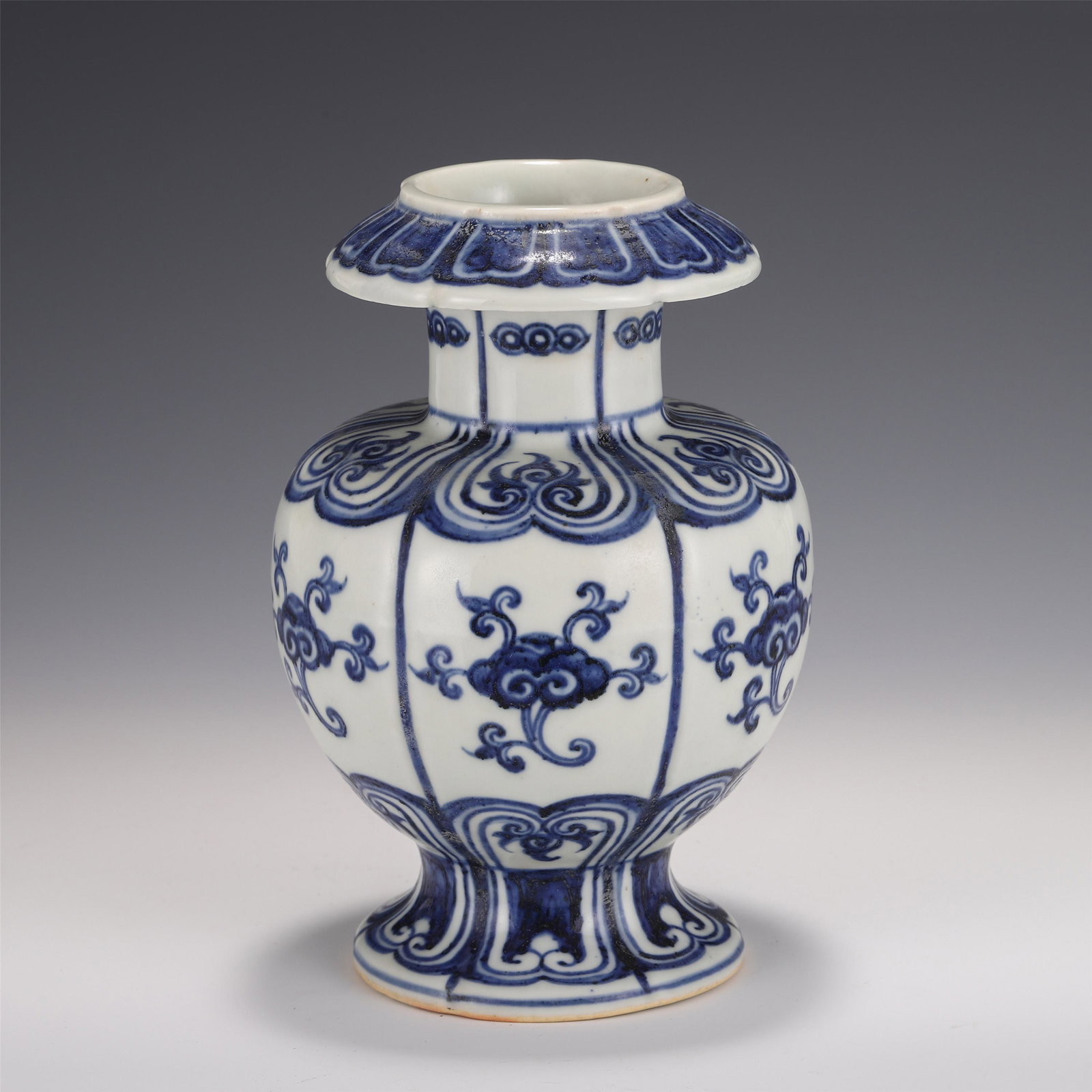 A CHINESE BLUE AND WHITE PORCELAIN VASE: 20 cm H x 13.5 cm Diam white glaze, the opening is natural, and the outer wall is painted with blue and white pile carving patterns. The layout of the jar is rigorous, the decorations are complex and 