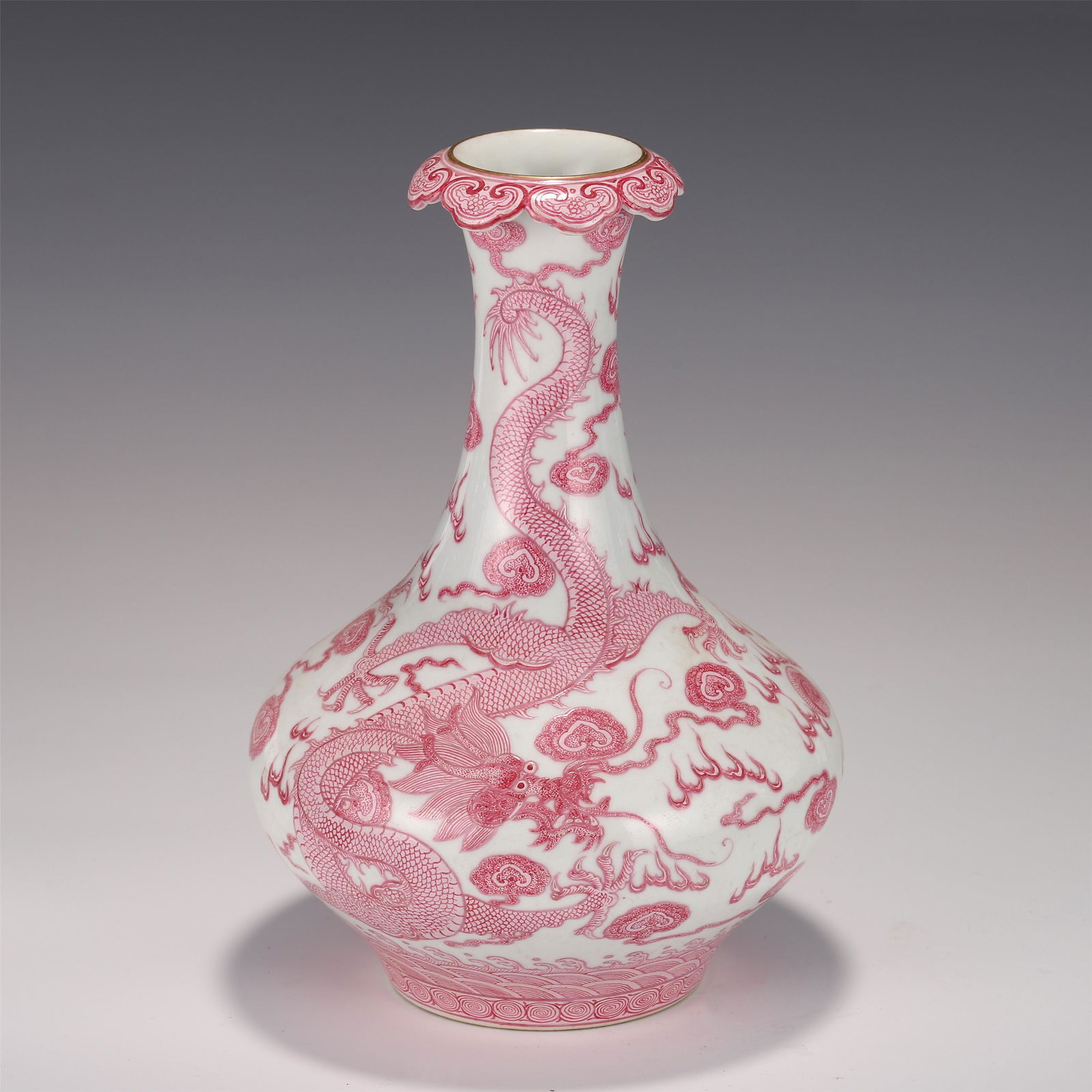A CHINESE RED GLAZED PORCELAIN VASE (1 of 8)