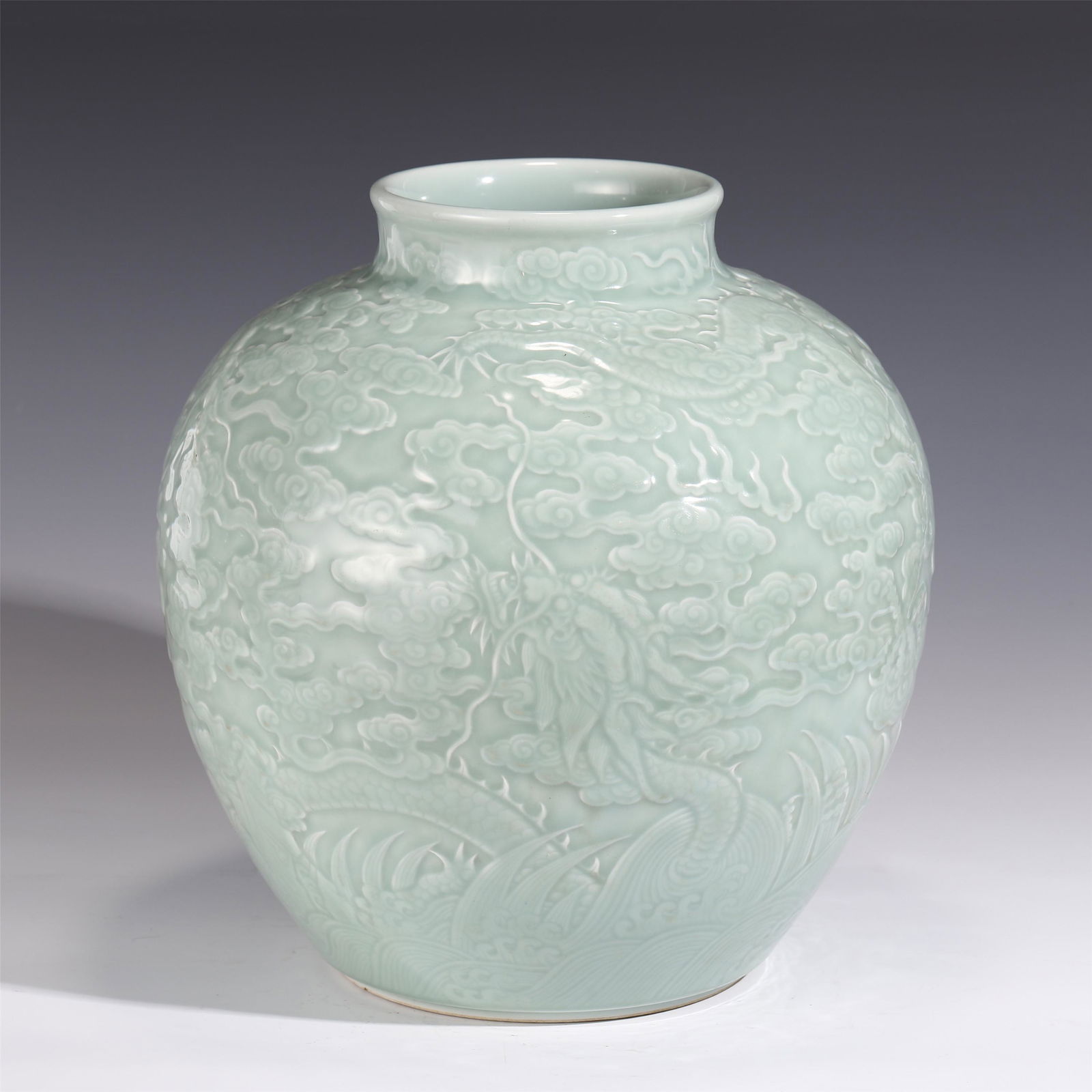 A CHINESE CELADON GLAZED PORCELAIN JAR (1 of 8)