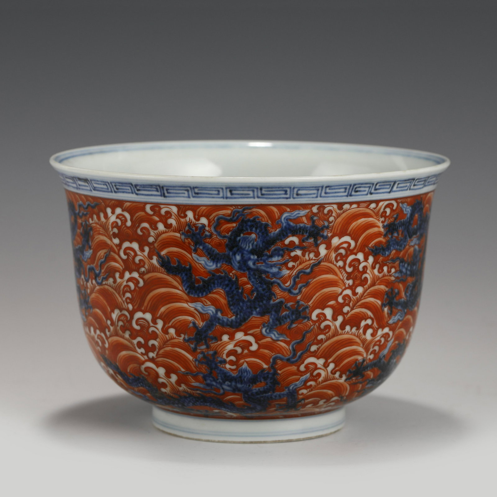 XUANDE ALUM RED BOWL: Dimensions (cm): Heigth: 10.5 Diam.: 15.5 Chinese Ming Dynasty XuanDe Blue and Red Dragon Porcelain Bowl. The porcelain potted with a shallow body, slight deep, thick, with angled cavetto elevated the