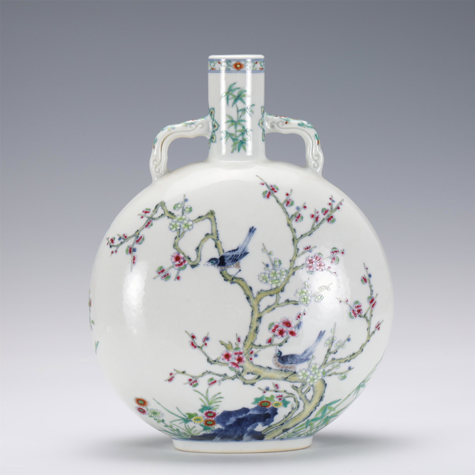 A CHINESE DOUCAI PORCELAIN FLASK MOON VASE, QIANLONG: A CHINESE DOUCAI PORCELAIN FLASK MOON VASE, QIANLONG 24 cm L x 15.3 cm W x 30.8 cm H x Weight 2570 gram. The flattened globular body rising from a rectangular foot to a flared neck flanked by a pair c