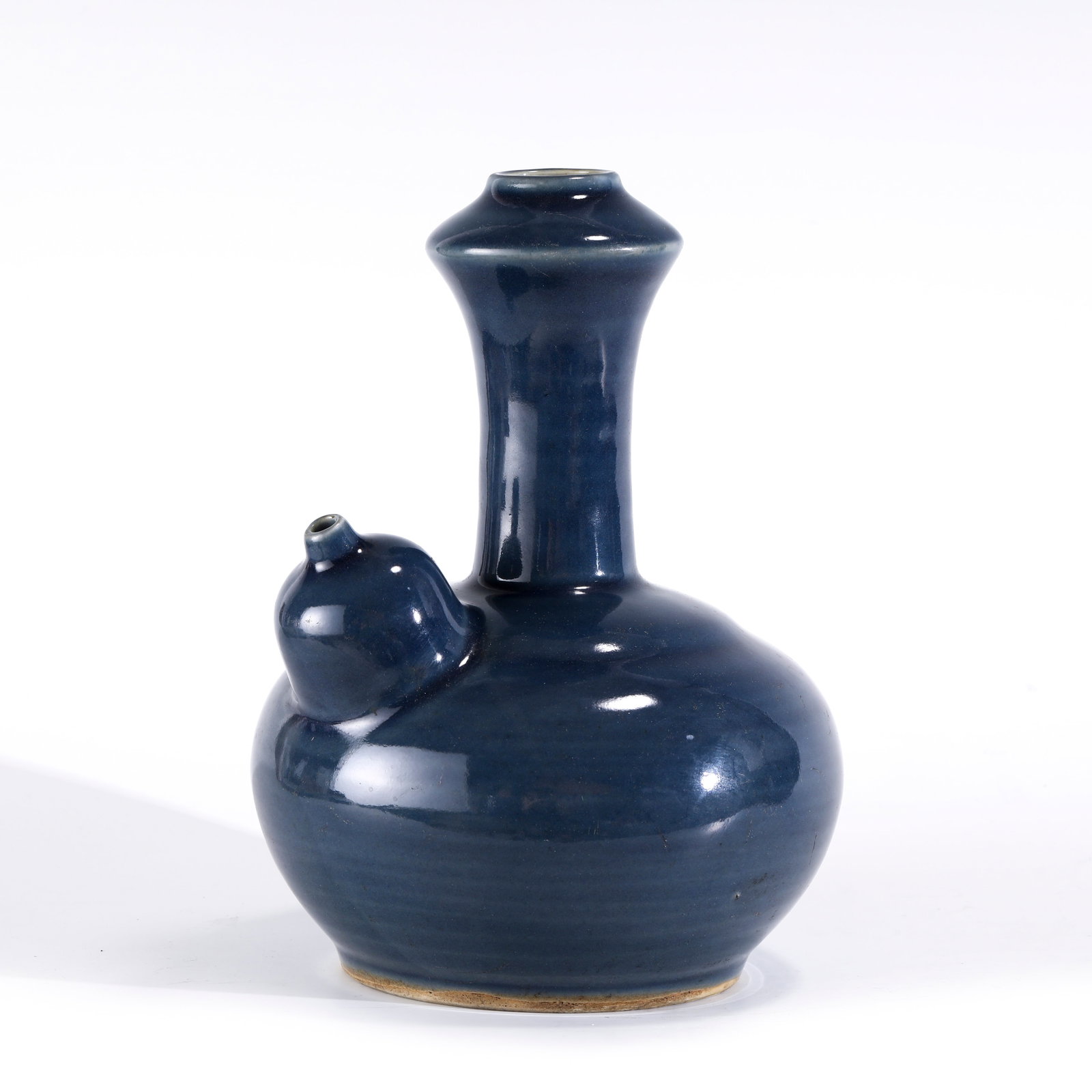 MING JI BLUE KETTLE: PROVENANCE: Hattiesburg, Mississippi, Private collector. Dimensons: Height: 22.2 cm, Diam: 16.5 cm Chinese Ming Dynasty Ji Blue Porcelain Kettle. Potted in kettle shape, thick and tall, globular lower