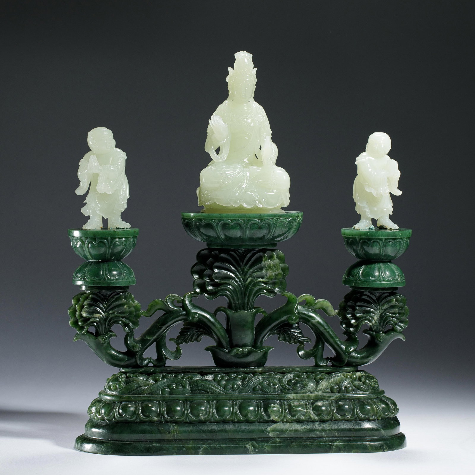 A CHINESE HETIAN JADE GUANYIN WITH ATTENDANTS (1 of 17)