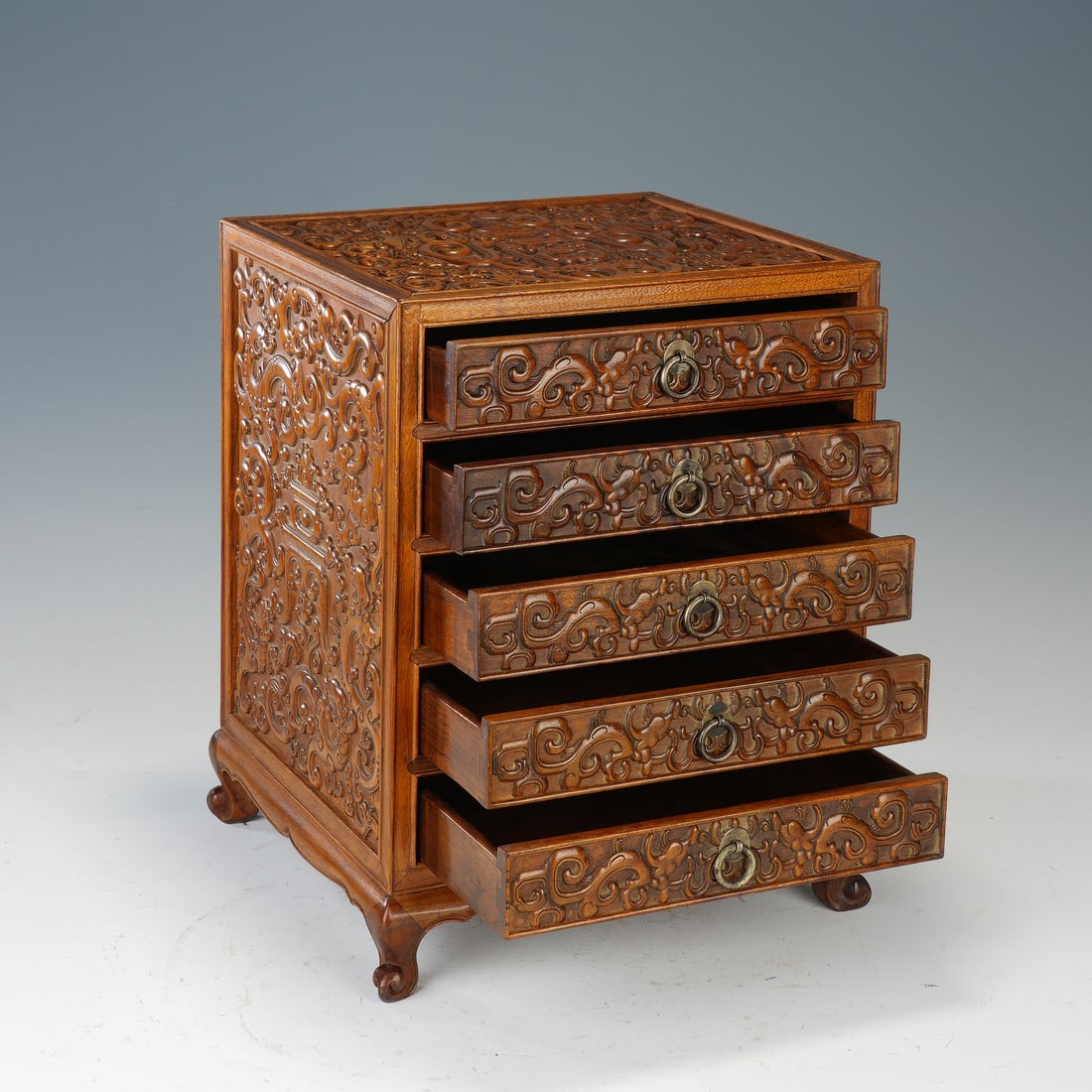 CHINESE HUANGHUALI CHILONG CHEST OF DRAWERS: Dimensions:24x25x31 cm. A fine Chinese Qing dynasty chest of drawers crafted from huanghuali (yellow pear wood), featuring a compact five-drawer design with elegant curved feet. The top, sides,