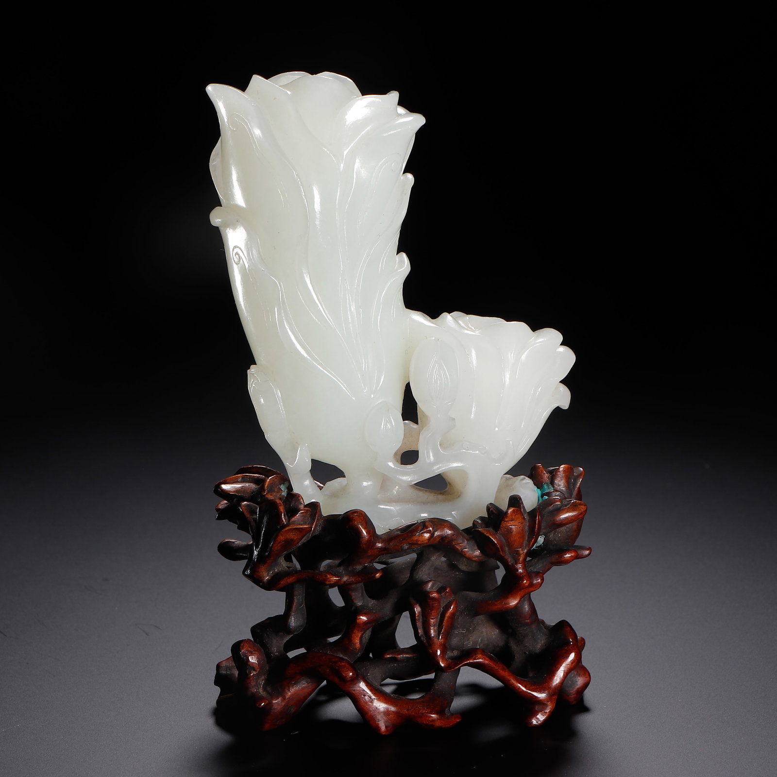 CHINESE WHITE JADE MAGNOLIA ORNAMENT: Dimensions:L. 6.5 cm. W. 3.8 cm. H. 11.5 cm. Weight 130 grams. A fine Chinese ornament carved from flawless white Hetian jade, depicting two magnolia flowers in full bloom, one tall and elegant,
