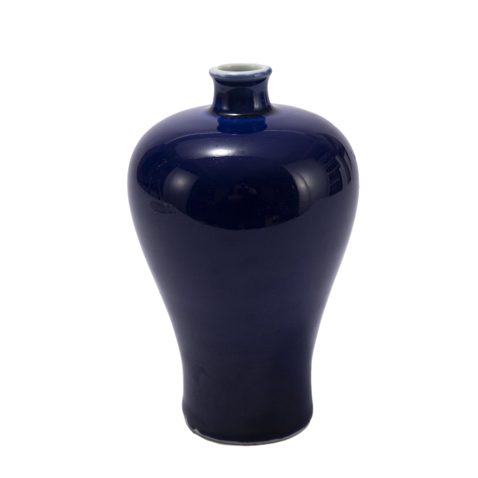 A CHINESE BLUE GLAZE PORCELAIN VASE: Dimensions:L. 9 cm. H. 15 cm. Weight 500 grams. Rising from a slightly splayed foot to a high-shoulder body blow a short, waisted neck, covered overall in a rich blue glaze.