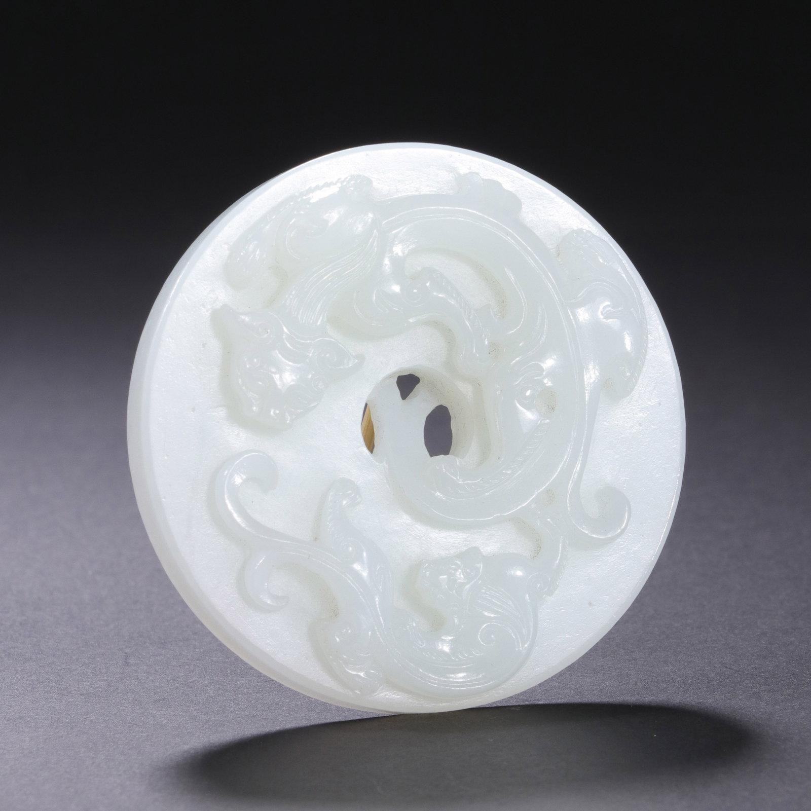 A CHINESE HETIAN WHITE JADE BI DISC WITH CHILONG RELIEF (1 of 9)