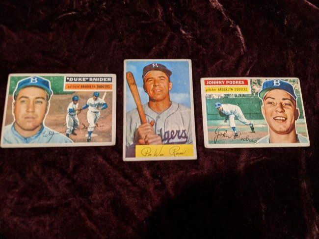 Brooklyn Dodgers card lot: Reese, Podres, Snider: 1954 Bowman Pee Wee Reese #58, 1956 Topps Johnny Podres #173 and 1956 Topps Duke Snider #150. See photos for condition of cards.