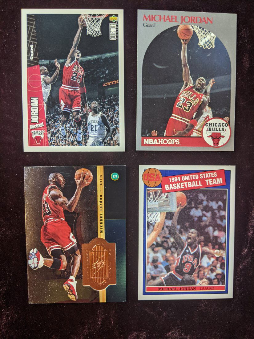 Michael Jordan basketball card lot: 1996 Upper Deck collector's Choice Michael Jordan #23, 1990 NBA Hoops Michael Jordan #65, 1998-99 Upper Deck Michael Jordan SPX Finite S1, 1984 US Olympic Team. See photos for condition of cards.