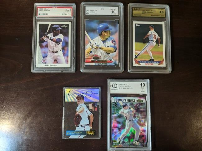 1990s Basebal card lot: 1990s Basebal card lot: 1990 Leaf Gary Ward #113, 1993 Stadium Club Ryne Sandberg #366, 1993 Topps Traded Greg Maddux #54T, 1996 Pinnacle Essence of the Game Greg Maddux #2, 1999 Topps Finest Gabe Kap