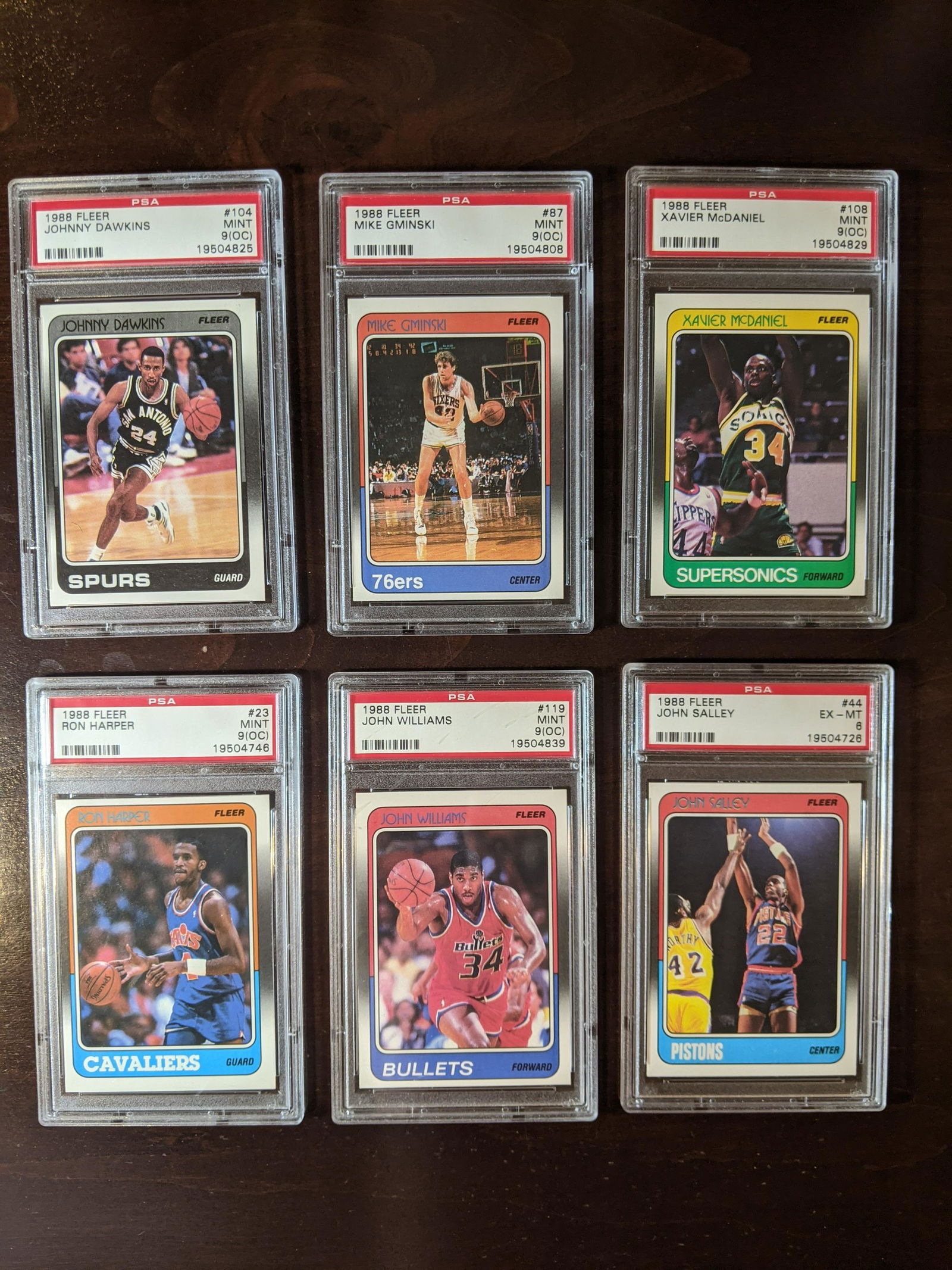 1988 Fleer lot of 6 PSA graded basketball cards: 1988 Fleer lot of 6 PSA graded basketball cards: Johnny Dawkins #104, Mike Gminski #87, Xavier McDaniel #108, Ron Harper #23, John Williams #119, John Salley #44. See photos for condition.