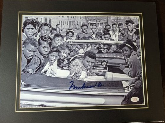 Muhammad Ali autographed photo: Unique Muhammad Ali autographed and matted photo authenticated by Showcase Authentics. See photos for condition.
