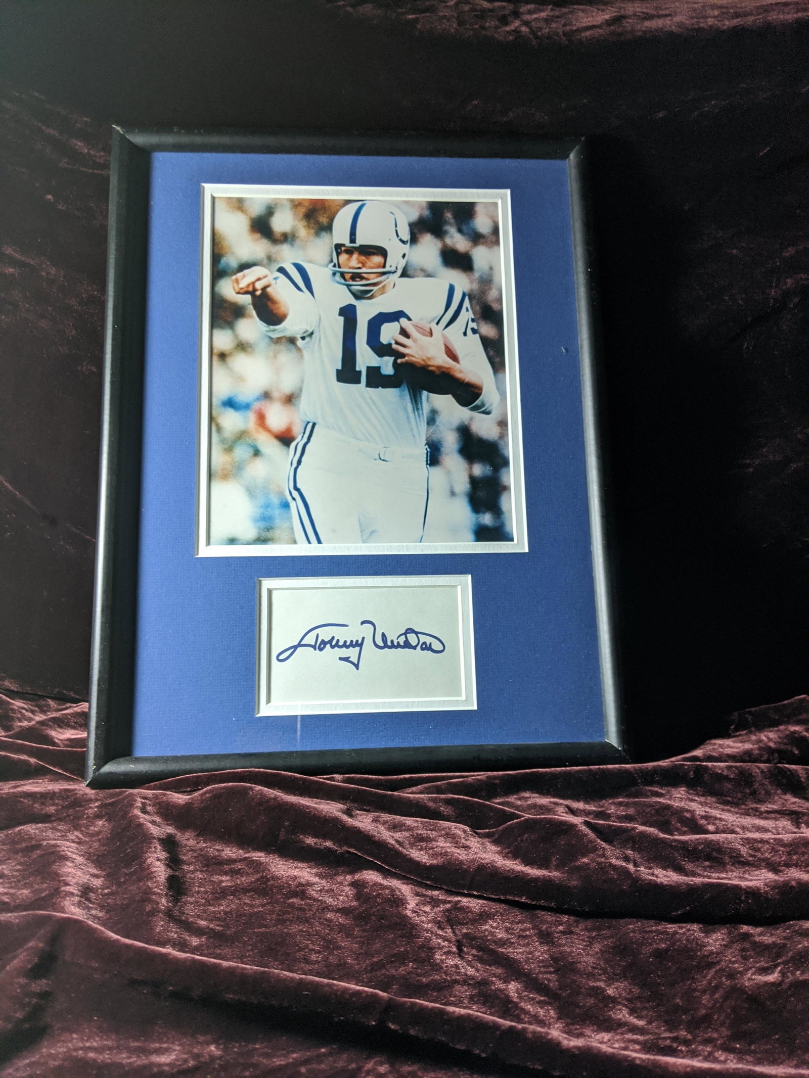 Johnny Unitas framed, matted photo with signed cut: A yet to be authenticated framed, matted photo with signed Johnny Unitas cut. See photos for condition.