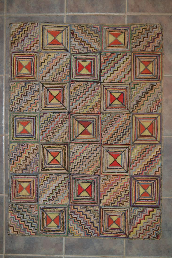 FOLD ART ANTIQUE GEOMETRIC HOOKED RUG. 42" x 31" (1 of 2)