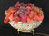 A FINE VICTORIAN BRONZE AND CZECH GLASS BASKET OF FRUIT