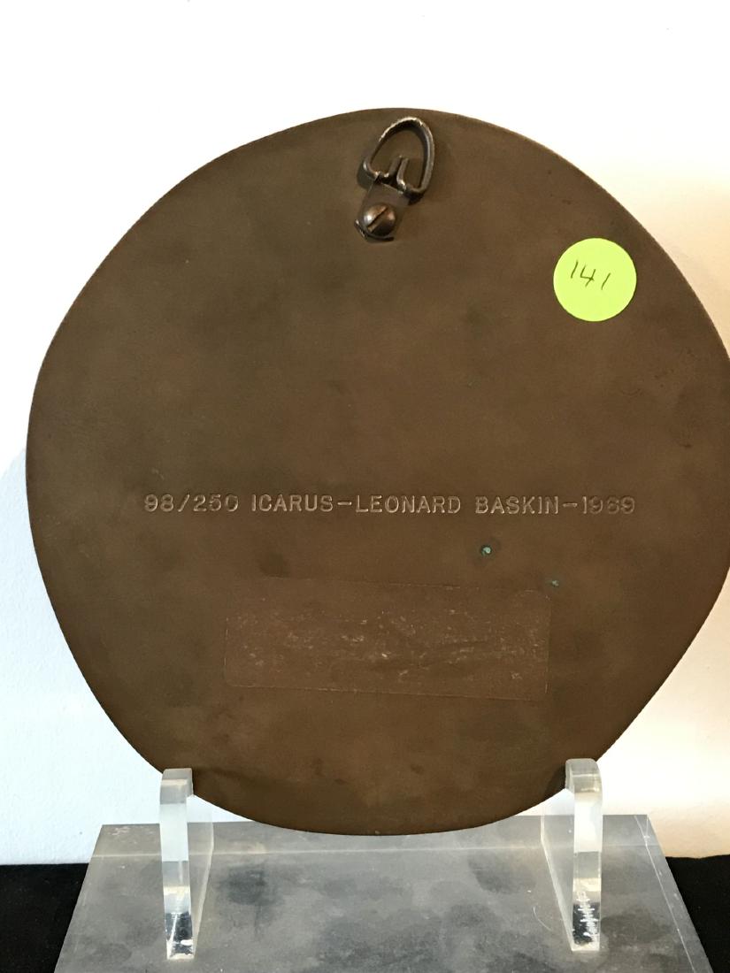 A LEONARD BASKIN CIRCULAR BRONZE PLAQUE "APOLLO". 7" D: A LEONARD BASKIN CIRCULAR BRONZE PLAQUE "APOLLO". 7" D 1969, 98/250 WITH ORIGINAL LUCITE STAND