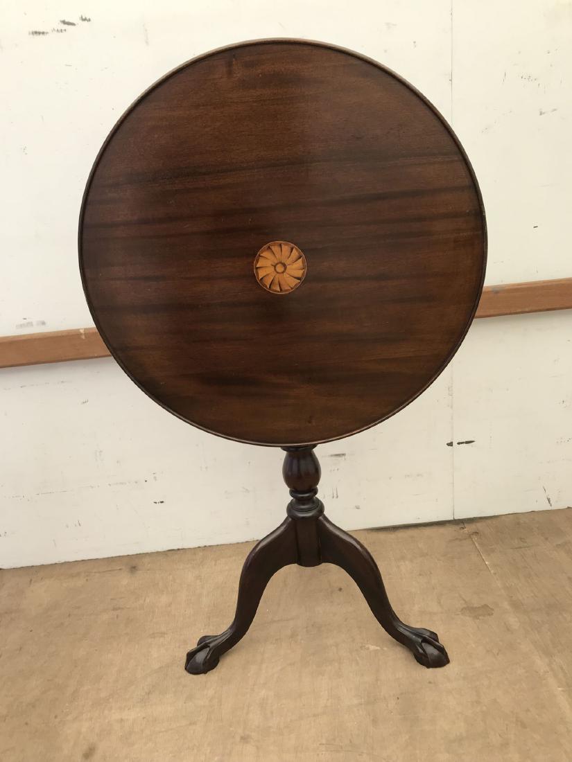 A MAHOGANY TILT TOP TABLE WITH PINWHEEL DECORATION: A MAHOGANY TILT TOP TABLE WITH PINWHEEL DECORATION