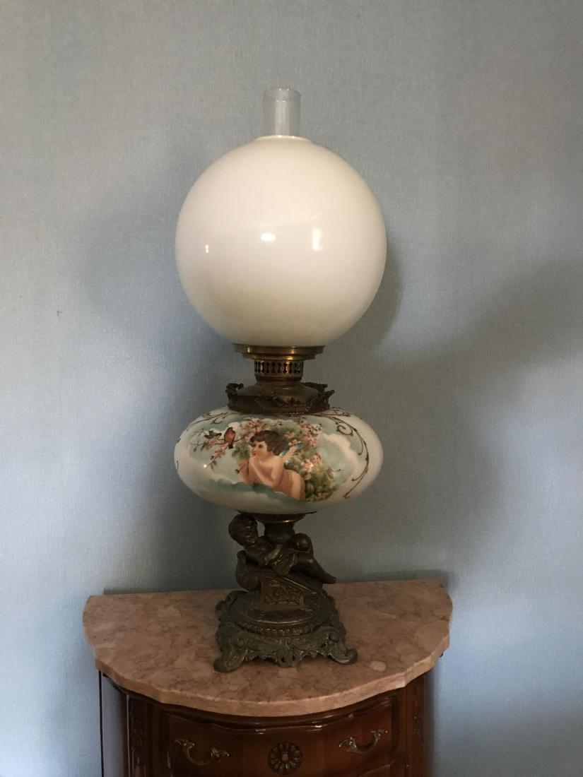 A HANDPAINTED GONE WITH THE WIND LAMP WITH CHERUBS AND: A HANDPAINTED GONE WITH THE WIND LAMP WITH CHERUBS AND BRONZE CHERUB BASE