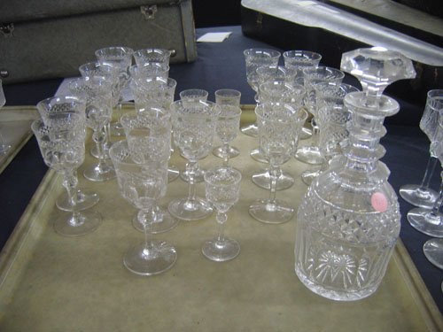 CUT CRYSTAL DECANTER AND 19 PIECES CUT CRYSTAL