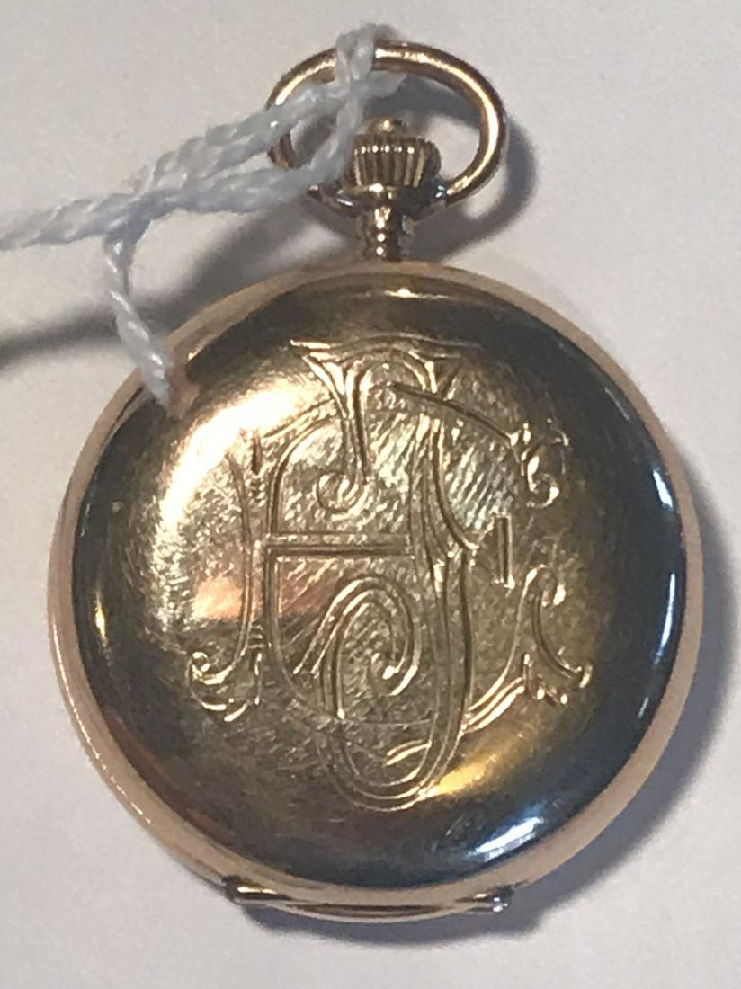 A FINE ANTIQUE 14K GOLD SWISS INTERNATIONAL LADIES: A FINE ANTIQUE 14K GOLD SWISS INTERNATIONAL LADIES WATCH. EXCELLENT WORKING CONDITION WITH DOUBLE SQURREL MARK AND CROWN AND 585 . 40 GRAMS TOTAL WEIGHT. PROPERTY FROM THE OLD NEWFANE INN OF VERMONT