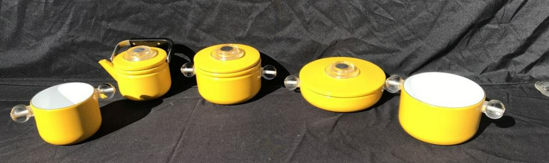 A 6 PIECE YELLOW ENAMEL ARABIA MID CENTURY MODERN: A 6 PIECE YELLOW ENAMEL ARABIA MID CENTURY MODERN COOKWARE SET. PROPERTY FROM THE ESTATE OF THE LEIF WESSMANN