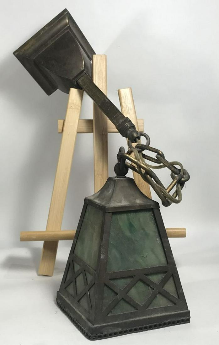 AN ARTS AND CRAFTS STAINED GLASS PENDANT LAMP 9" X 5": AN ARTS AND CRAFTS STAINED GLASS PENDANT LAMP 9" X 5" PENDANT . CHAIN AND MOUNTING FICTURE 21". PROPERTY FROM THE LINCOLN ESTATE OF TURNERS FALLS MASSACHUSETTS