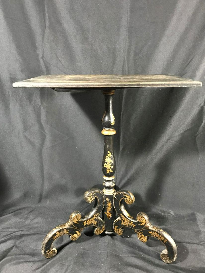 AN ANTIQUE LAMP TABLE IN DECORATED BLACK PAINT.: AN ANTIQUE LAMP TABLE IN DECORATED BLACK PAINT. PROPERTY FROM THE OLD NEWFANE INN OF VERMONT.