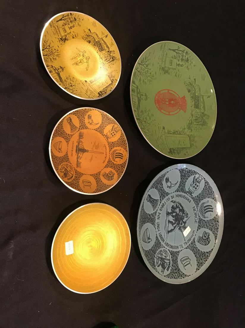 2 DECORATED 12.5" ENAMELED CHARGERS AND 3 GNES ALUMINUM: 2 DECORATED 12.5" ENAMELED CHARGERS AND 3 GNES ALUMINUM 7.5" PLATES. PROPERTY FROM THE ESTATE OF LEIF WESSMANN
