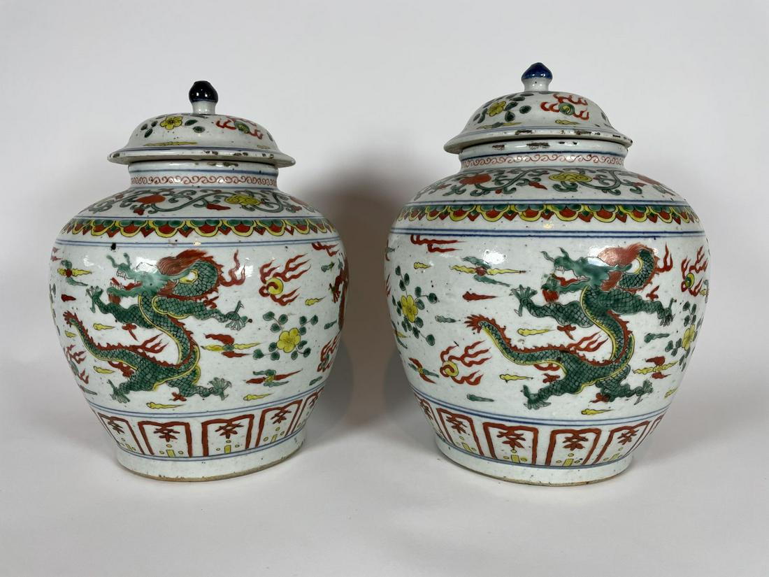 A PAIR OF MEIJI PERIOD STONEWARE MELON JARS POLYCHROME: A PAIR OF MEIJI PERIOD STONEWARE MELON JARS POLYCHROME DECORATION WITH DRAGONS AND FLORAL SWAGS 11" T X 8" D. WEIGHS 6 LBS 8 OZ EACH (2)
