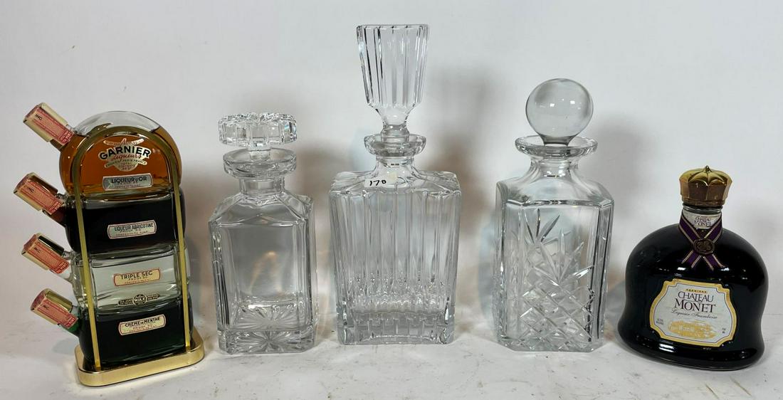 THREE CUT CRYSTAL DECANTERS 13" AND SMALLER, WITH A: THREE CUT CRYSTAL DECANTERS 13" AND SMALLER, WITH A GARNIER LIQUORS MINIATURE DISPLAY AND A BOTTLE OF CHATEAU MONET FRAMBOISE