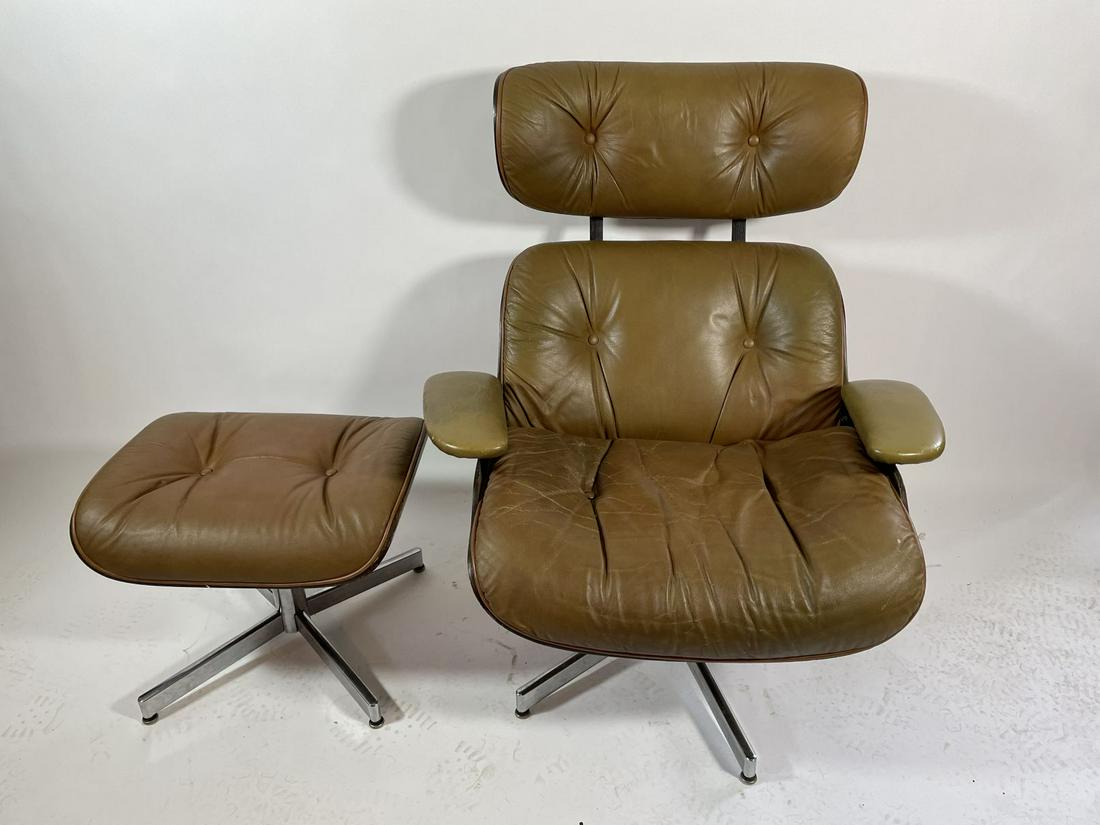 TAN LEATHER EAMES CHAIR WITH OTTOMAN . SELIG: TAN LEATHER EAMES CHAIR WITH OTTOMAN . SELIG MANUFACTURING. MADE 1960S. MISSING BUTTON IN SEAT . OVEERALL WEAR CONSISTENT WITH AGE AND USE.