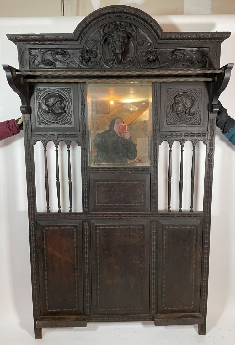 BLACK FOREST CARVED ENTRY RACK WITH BRASS ROD SHELVES: BLACK FOREST CARVED ENTRY RACK WITH BRASS ROD SHELVES AND THE FINEST CARVED PORTRAIT PANELS AFTER OLD MASTERS