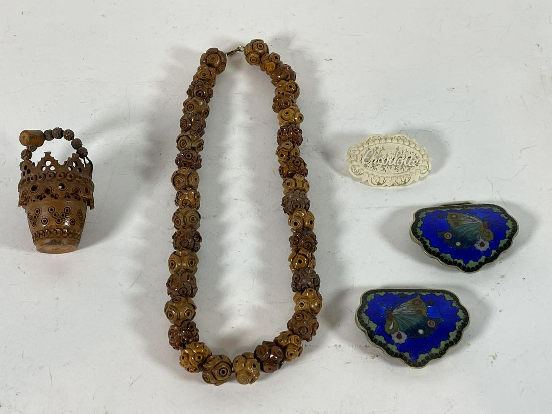 A CHINESE CARVED WALNUT VICTORIAN BEAD STRAND AND: A CHINESE CARVED WALNUT VICTORIAN BEAD STRAND AND PAIL, AND AN ENAMELED BUTTERFLY BUCKLE