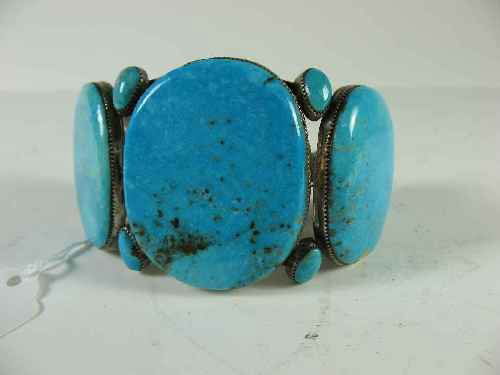NATIVE AMERICAN TURQOUISE AND STERLING CUFF BRACELET : LARGE STONED TURQUOISE AND STERLING SILVER CUFF BRACELET. 3"D