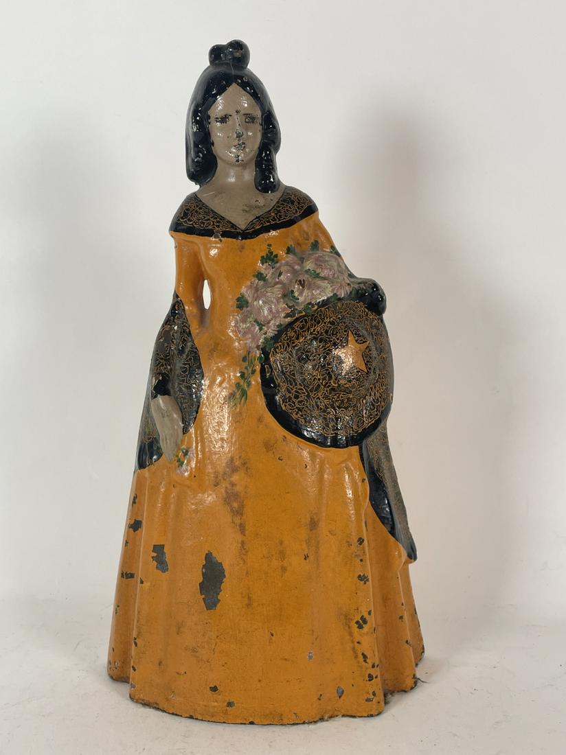 A CAST IRON DOORSTOP OF A VICTORIAN WOMAN 12" TALL X 6" (1 of 2)