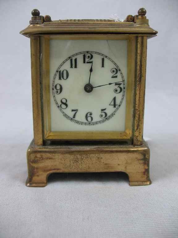 WATERBURY CARRIAGE CLOCK WORKS WELL 4"T- LINE: WATERBURY CARRIAGE CLOCK WORKS WELL 4"T- LINE IN ENAMEL FACE, CHIPPING TO SIDE CRYSTALS