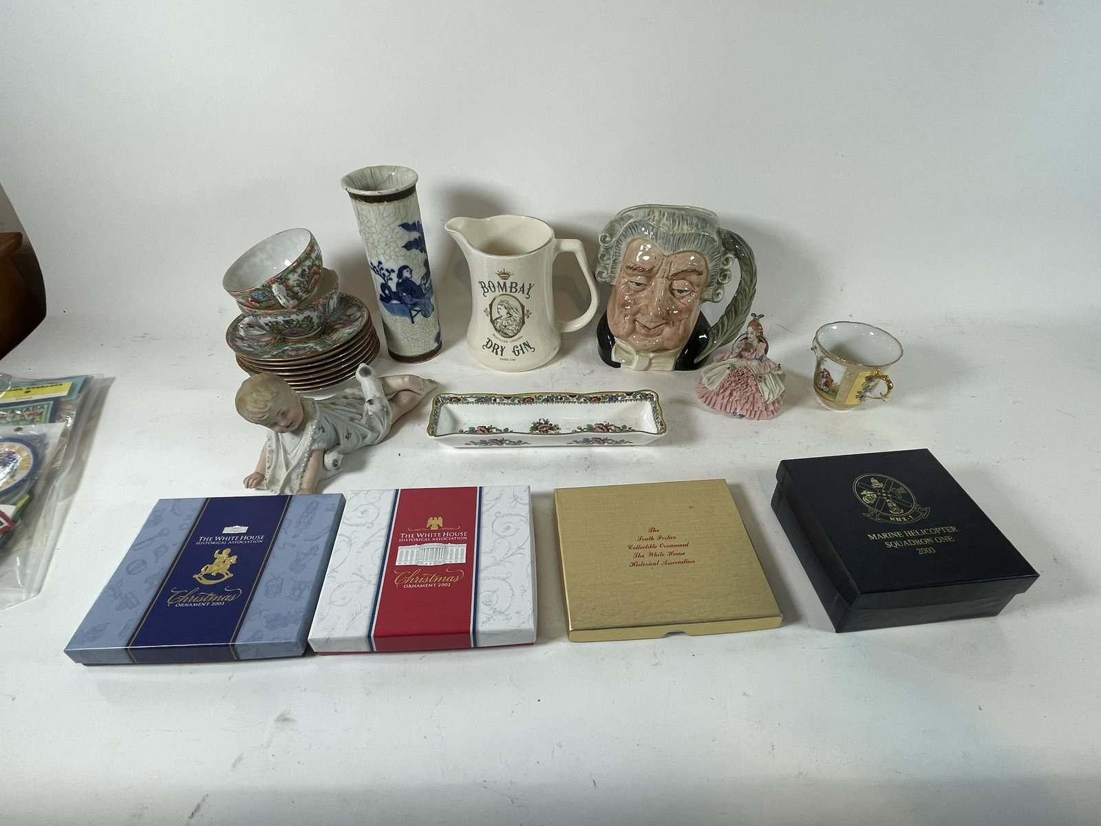 FOUR WHITEHOUSE CHRISTMAS ORNAMENTS, A ROYAL DOULTON: FOUR WHITEHOUSE CHRISTMAS ORNAMENTS, A ROYAL DOULTON CHARACTER MUG SIGNED MICHAEL DOULTON AND OTHER PORCELAINS. SEE PICTURE . DAMAGE TO CHINESE VASE AND PIANO BABY