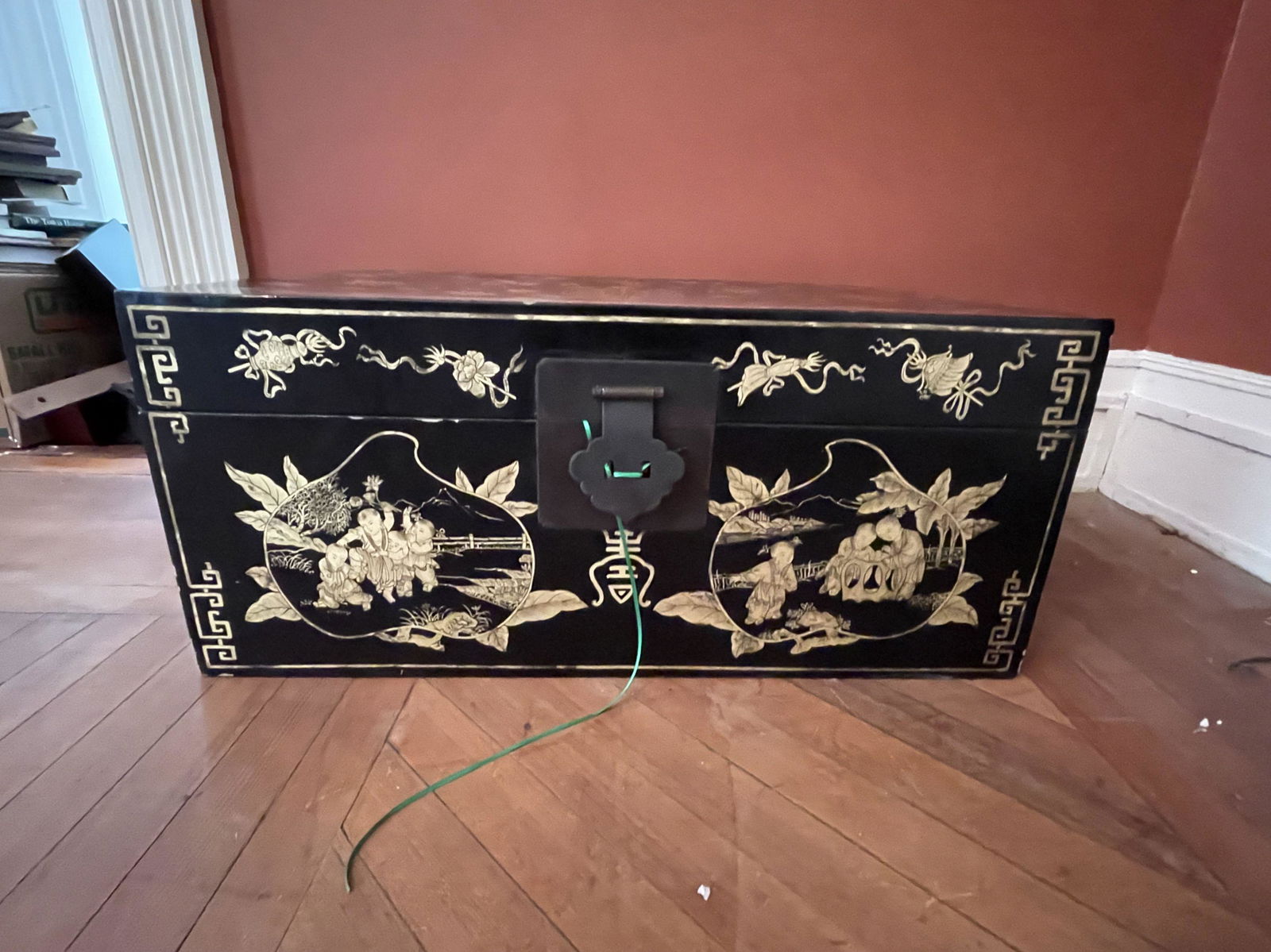 A GILT DECORATED BLACK LAQUER BOX. 14" X 32" X 20" (1 of 4)