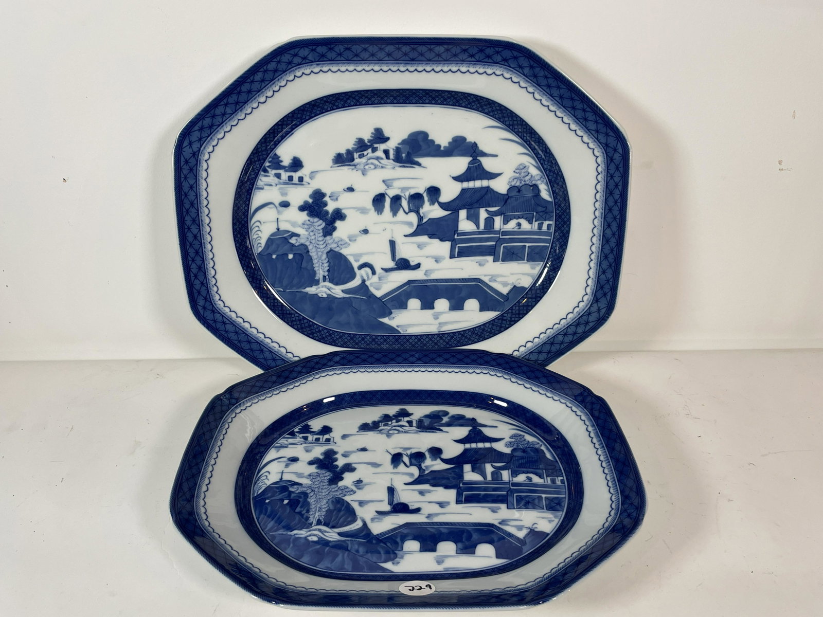 TWO MOTTAHEDEH CANTON PLATTERS, 17" X 14" AND 15" X: TWO MOTTAHEDEH CANTON PLATTERS, 17" X 14" AND 15" X 12". PROPERTY OF A FINE SAG HARBOR ESTATE