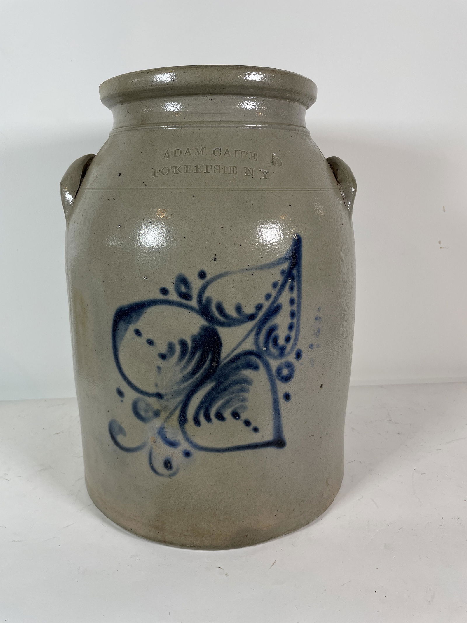 STONEWARE CROCK WITH BLUE DECORATION. PROPERTY OF (1 of 4)