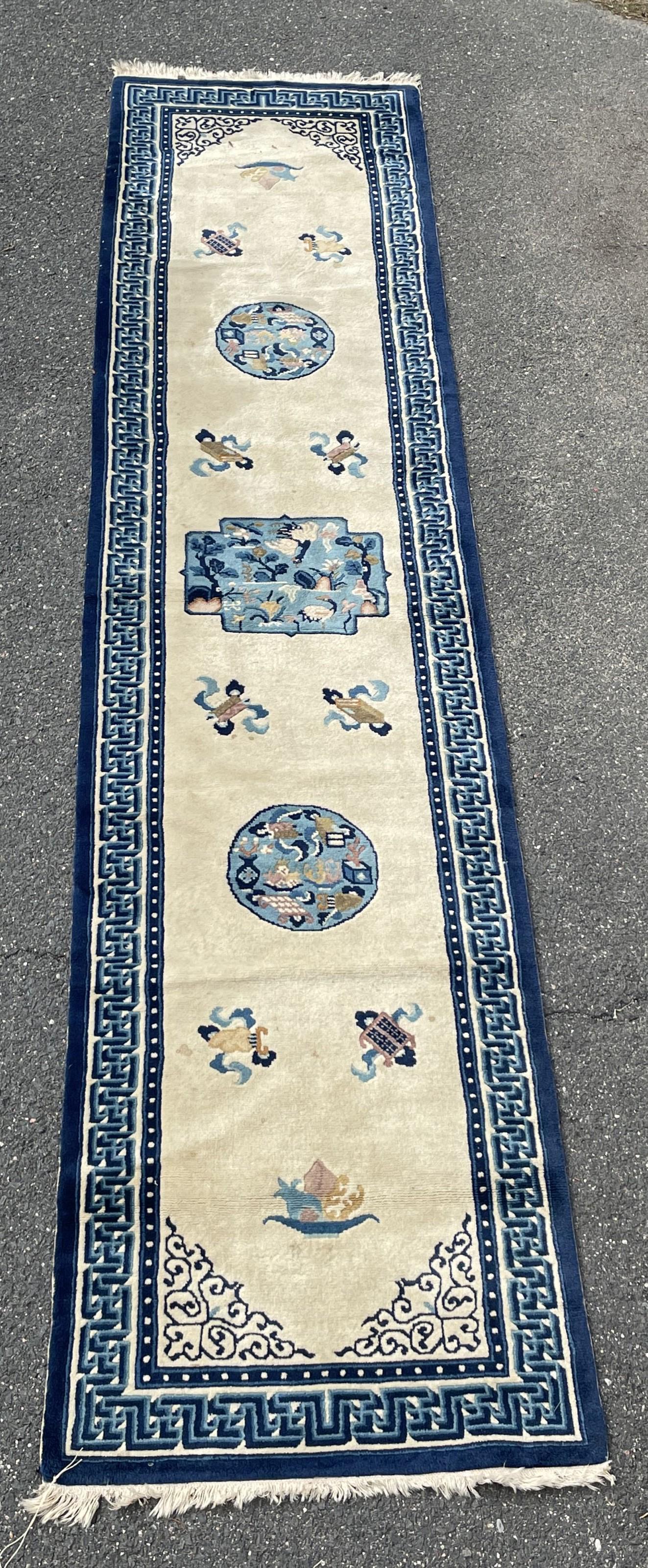 A BLUE AND WHITE CHINESE RUNNER RUG, 28" X 124". (1 of 5)