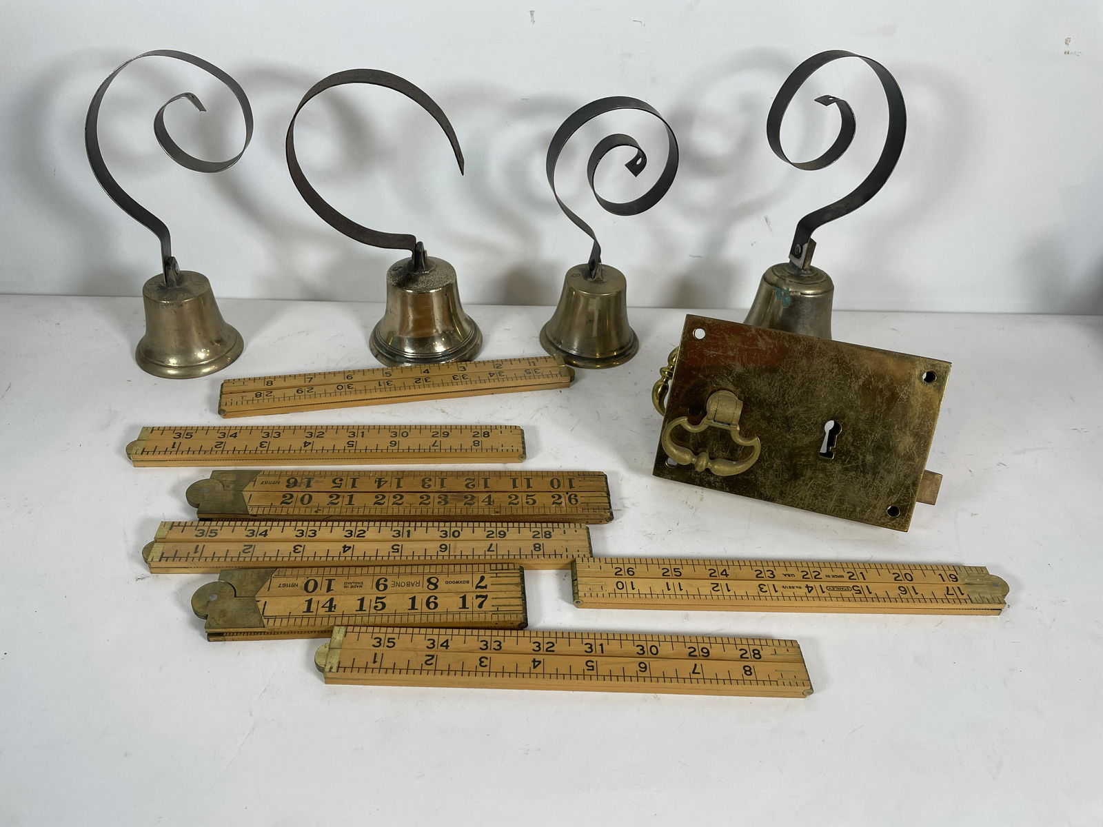 AN EARLY BRASS DOOR LOCK, 4 BRASS DOOR BELLS AND 7 (1 of 4)