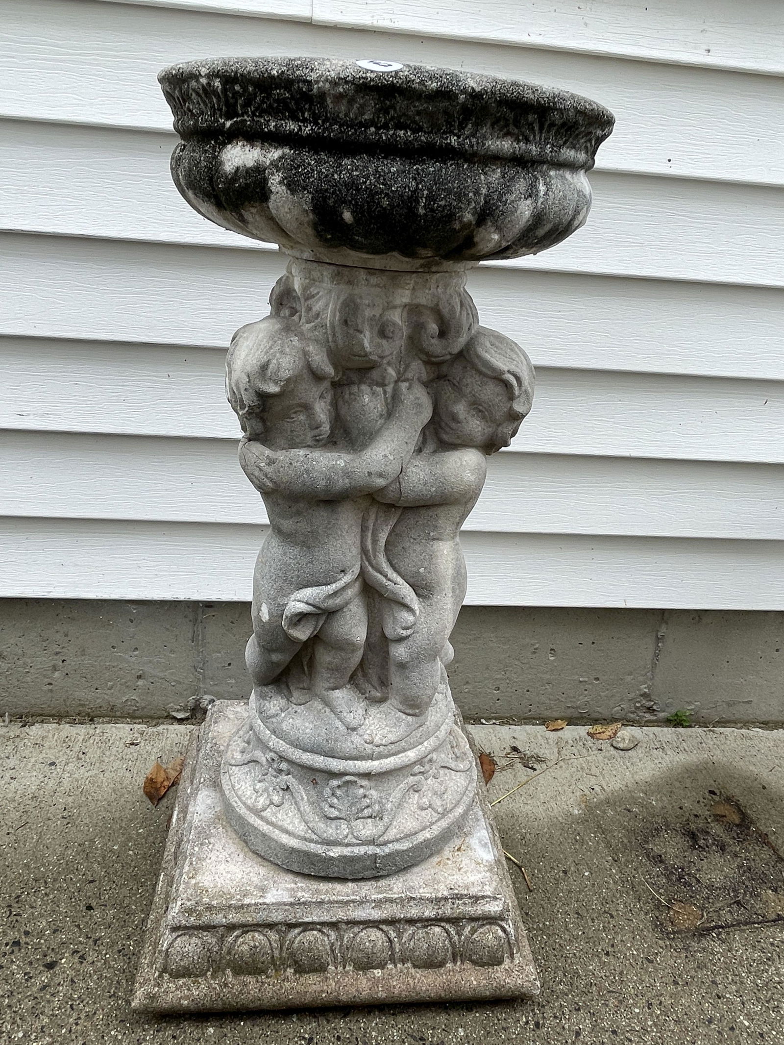 A CAST STONE BIRD BATH W/ CHERUBS, 13" DIAMETER X 29" (1 of 2)