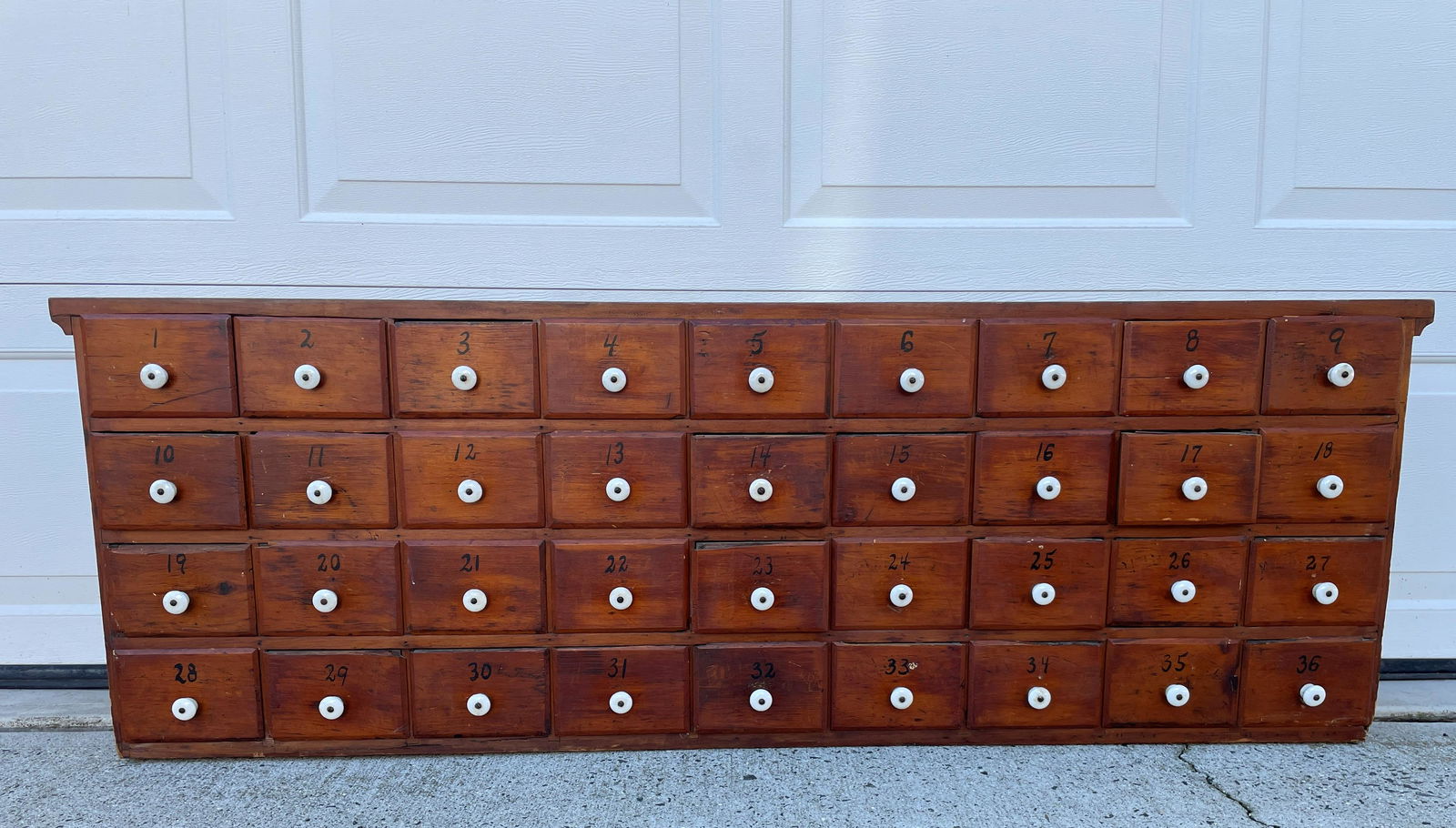 AN ANTIQUE SPICE CABINET WITH PORCELAIN PULLS (1 of 4)
