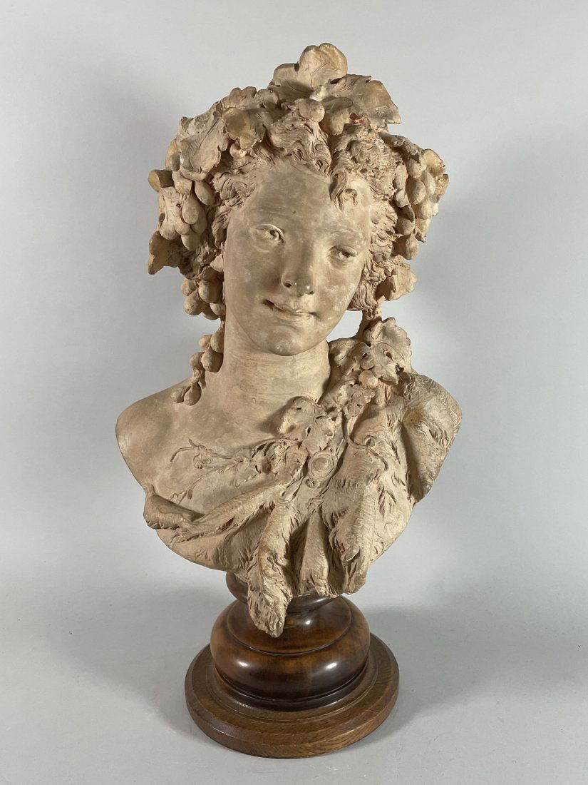 A TERRACOTTA BUST OF A WOMAN SIGNED A CARRIER ON A WOOD (1 of 6)
