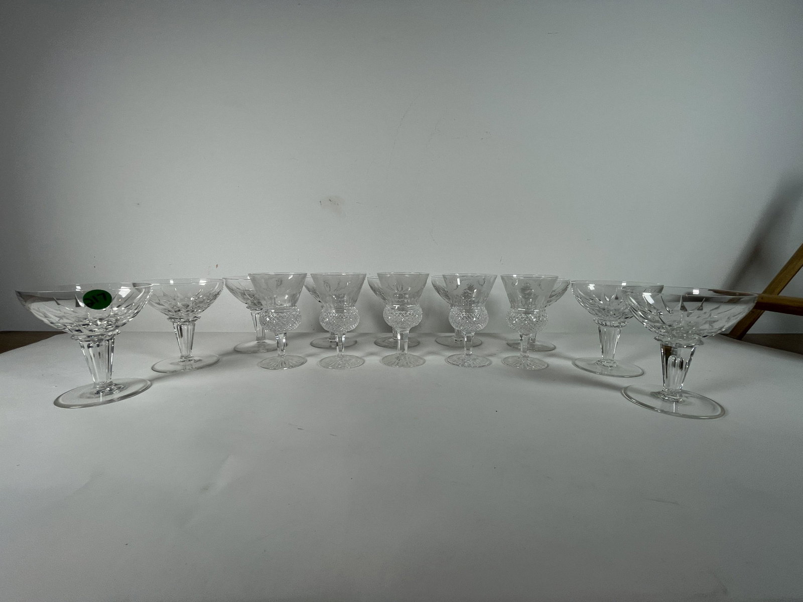 FIVE SCOTTISH THISTLE STEMS WITH ELEVEN CRYSTAL WINE: FIVE SCOTTISH THISTLE STEMS WITH ELEVEN CRYSTAL WINE GOBLETS AND NINE CRYSTAL CHAMPAGNES. 4.75" TALL STEMS, 4.5" TALL CHAMPAGNES, AND 6.25" TALL WINES