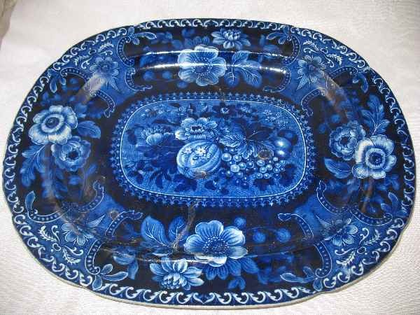 FLOW BLUE PLATTER MADE BY LONGPORT 18 1/2" X: FLOW BLUE PLATTER MADE BY LONGPORT 18 1/2" X 15" NUMEROUS OLD REPAIRS