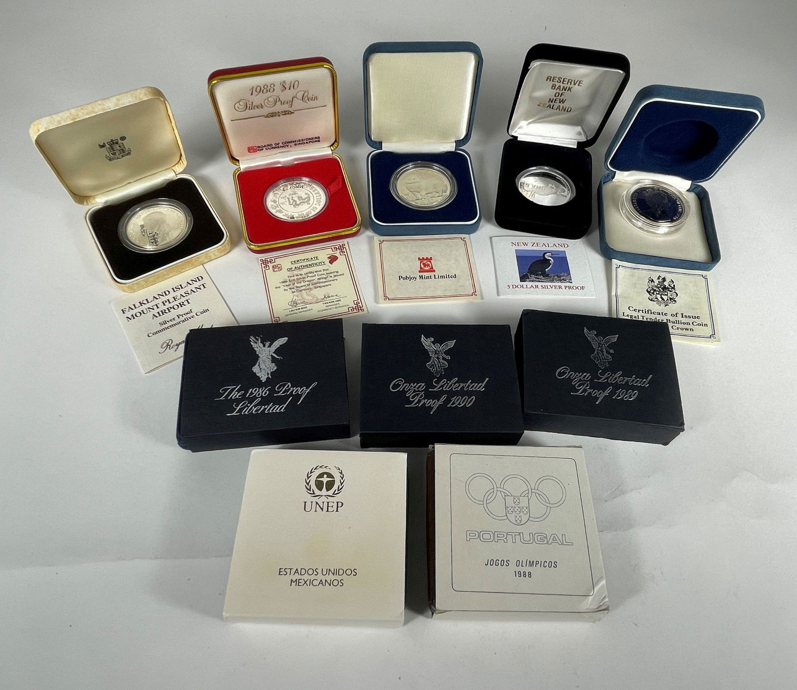 10 STERLING SILVER PROOF COINS INCLUDES SINGAPORE, MEXICO. 28 - 32 GRAMS EACH (1 of 4)